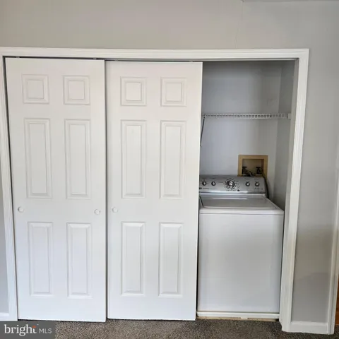 a utility room with washer and dryer