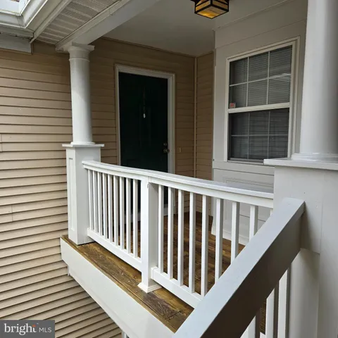 a view of a balcony with front door