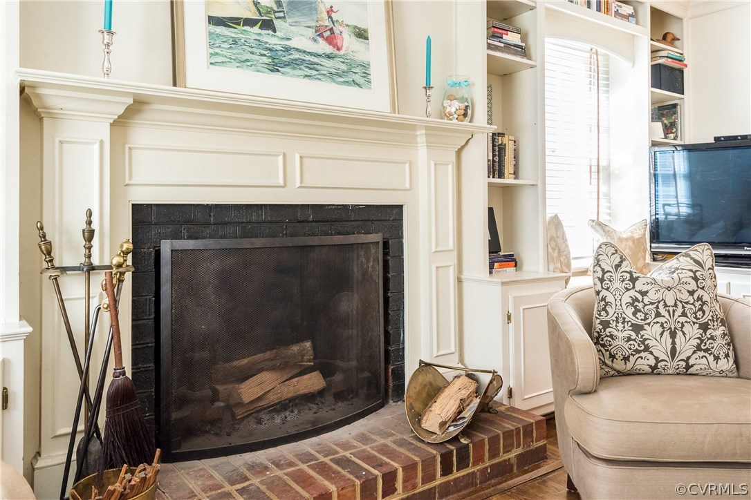 108 Ralston Road Henrico, VA 23229 - Photo 20 of 42 a living room with furniture a fireplace and a floor to ceiling window