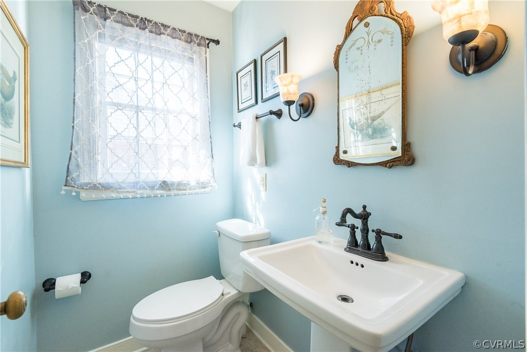 108 Ralston Road Henrico, VA 23229 - Photo 23 of 42 a bathroom with a toilet sink and mirror