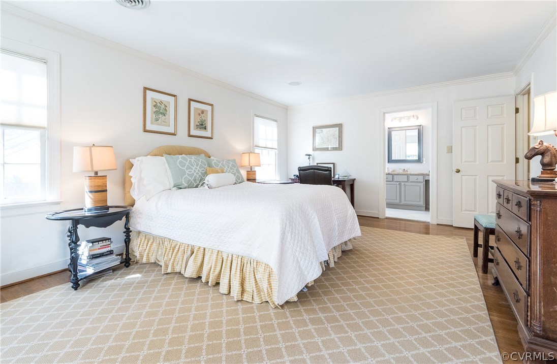 108 Ralston Road Henrico, VA 23229 - Photo 26 of 42 a spacious bedroom with a bed and a table in it