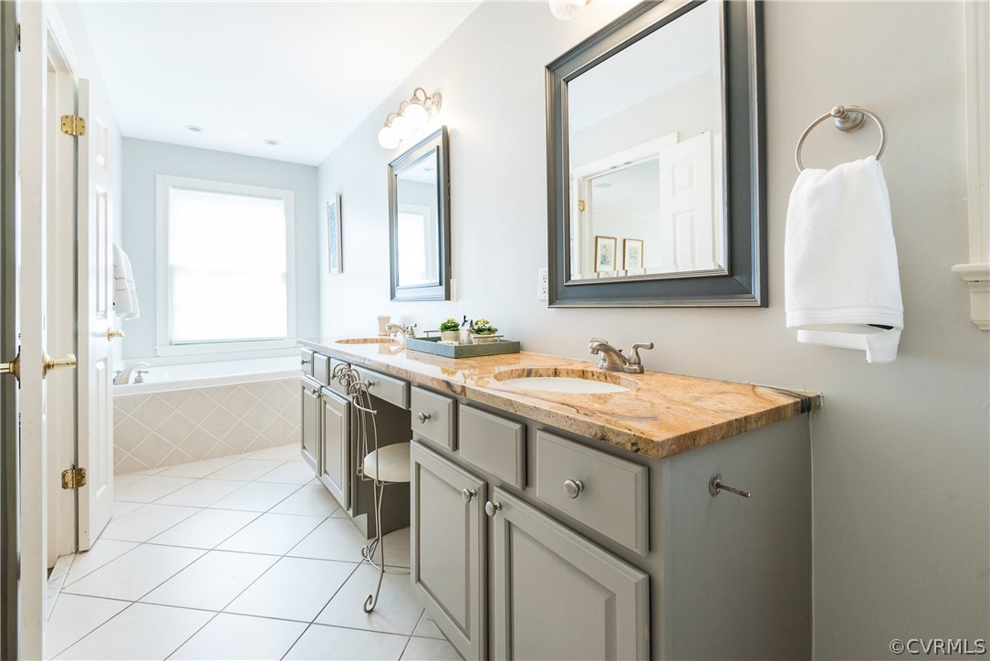 108 Ralston Road Henrico, VA 23229 - Photo 27 of 42 a bathroom with a granite countertop sink a toilet and a mirror