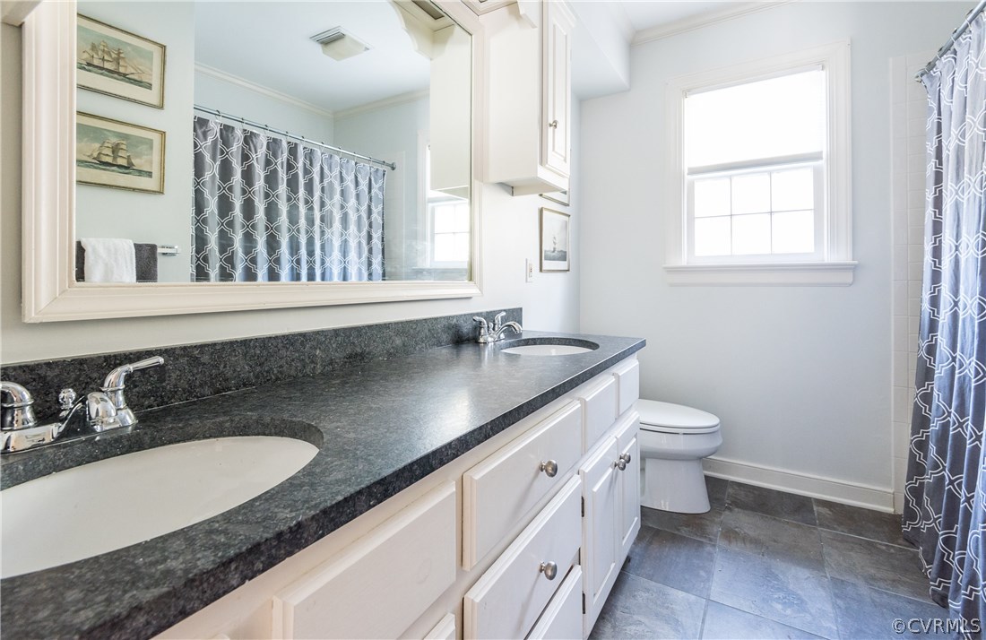 108 Ralston Road Henrico, VA 23229 - Photo 29 of 42 a bathroom with a granite countertop sink a toilet and a mirror