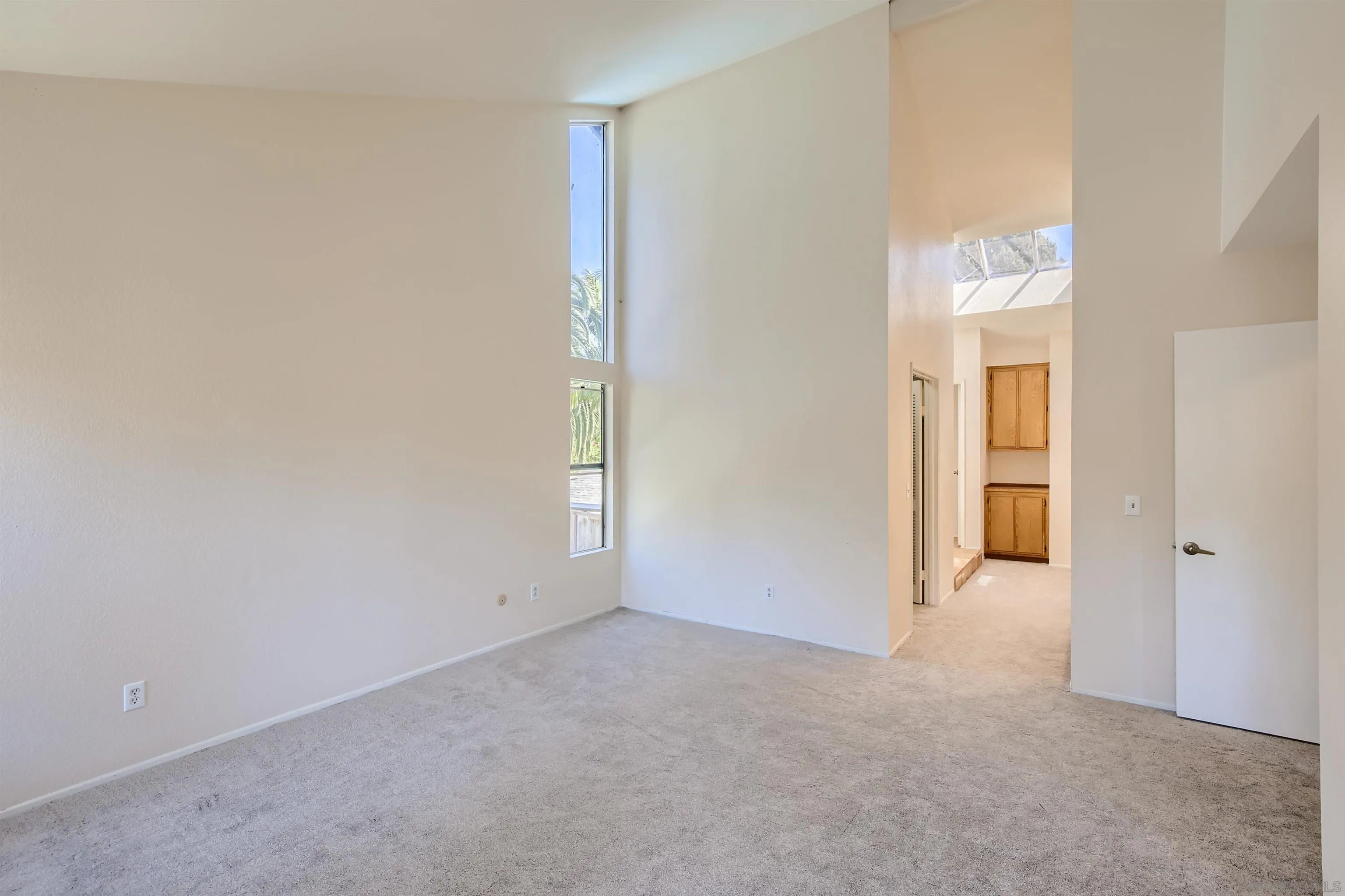 535 Gardendale Road Encinitas, CA 92024 - Photo 11 of 23 an empty room with windows and entrance
