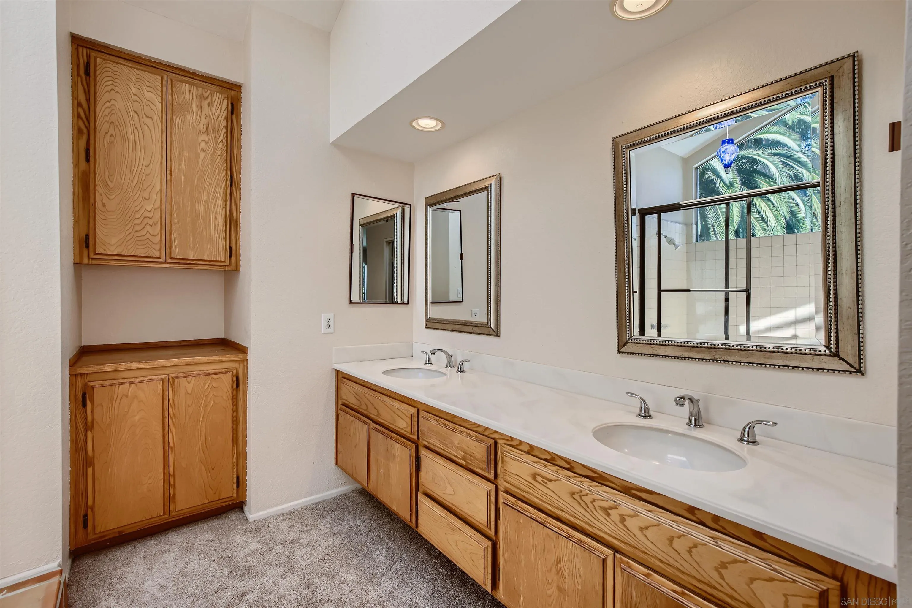 535 Gardendale Road Encinitas, CA 92024 - Photo 13 of 23 a bathroom with double vanity sink a mirror and a window