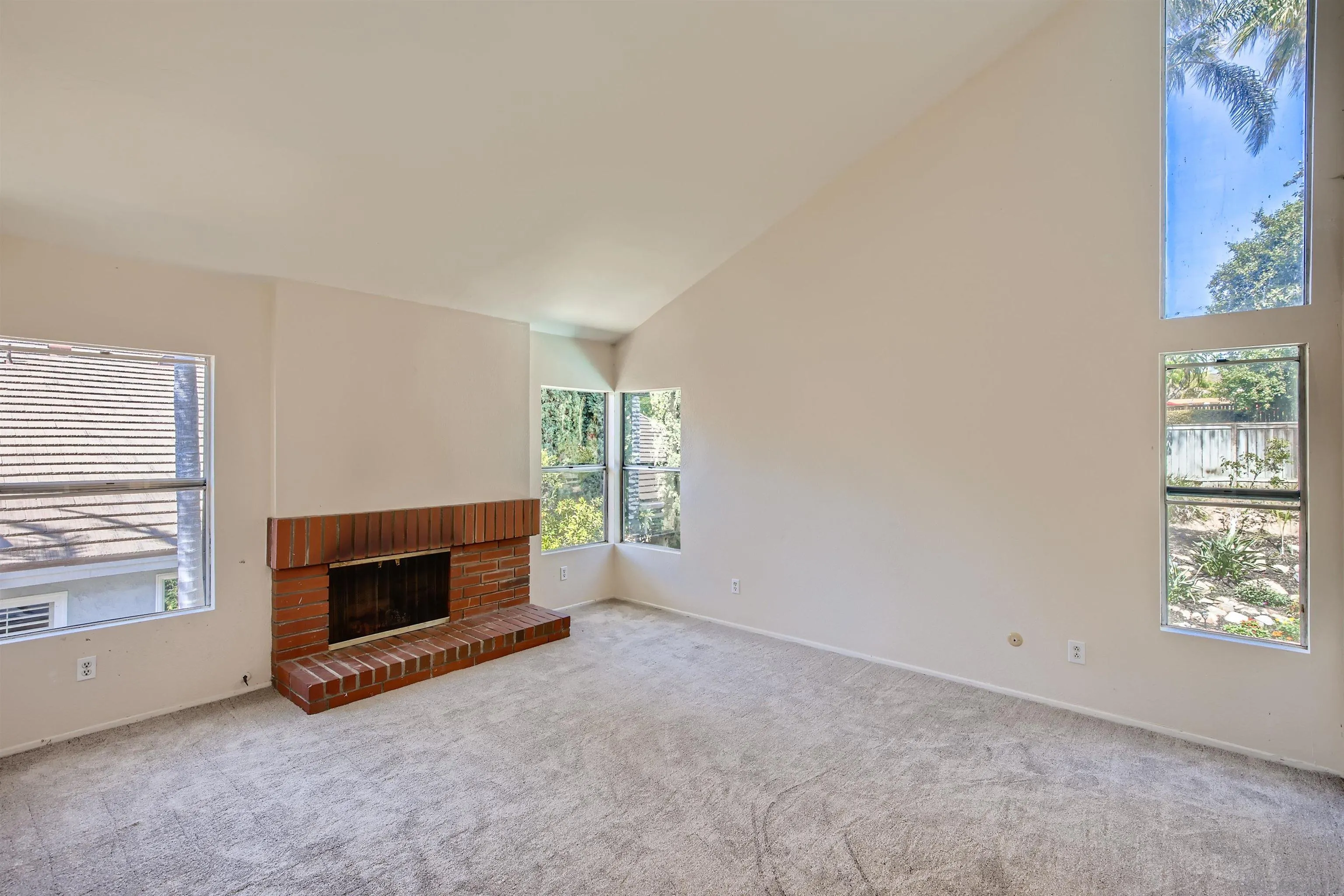 535 Gardendale Road Encinitas, CA 92024 - Photo 10 of 23 an empty room with furniture and a fireplace