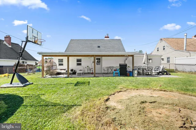 a view of a house with backyard and a slide