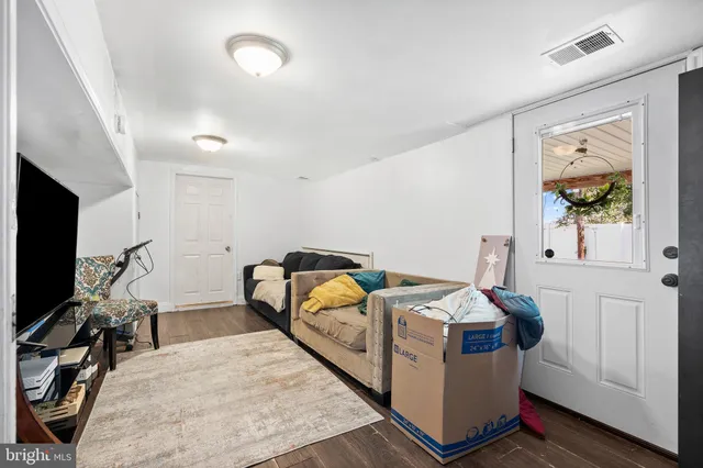 a bed room with a bed and a flat tv screen