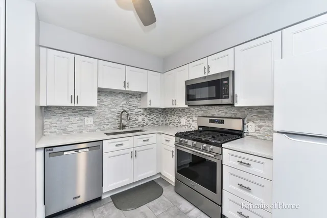 a view of kitchen with furniture and wooden floor
