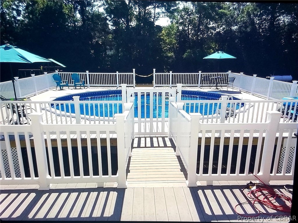 672 Lillys Neck Road Moon, VA 23119 - Photo 14 of 49 a view of a roof deck with furniture