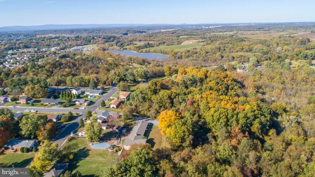 an aerial view of residential building with green space