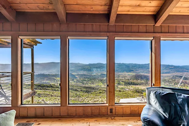 a view of a living room and a large window