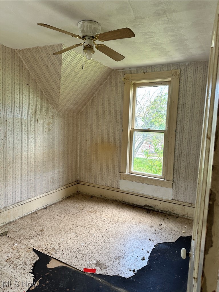 6144 Jefferson Road Ashtabula, OH 44004 - Photo 13 of 30 Bonus room featuring a ceiling fan and wallpapered walls