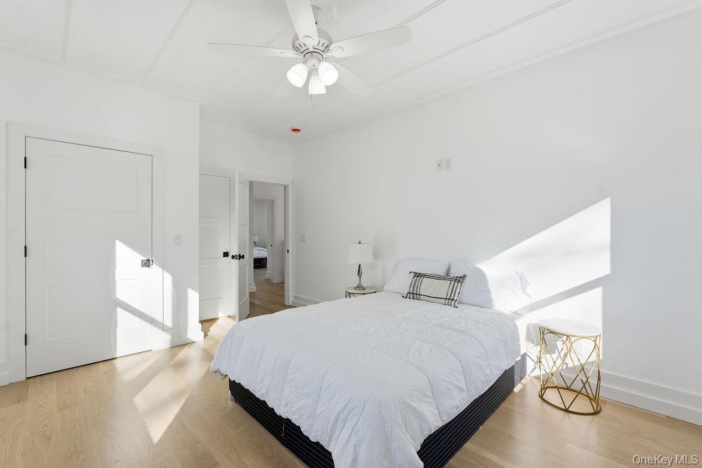 768 Bridgehampton Sag Harbor Bridgehampton, NY 11932 - Photo 25 of 35 Bedroom featuring light wood-style floors and a ceiling fan