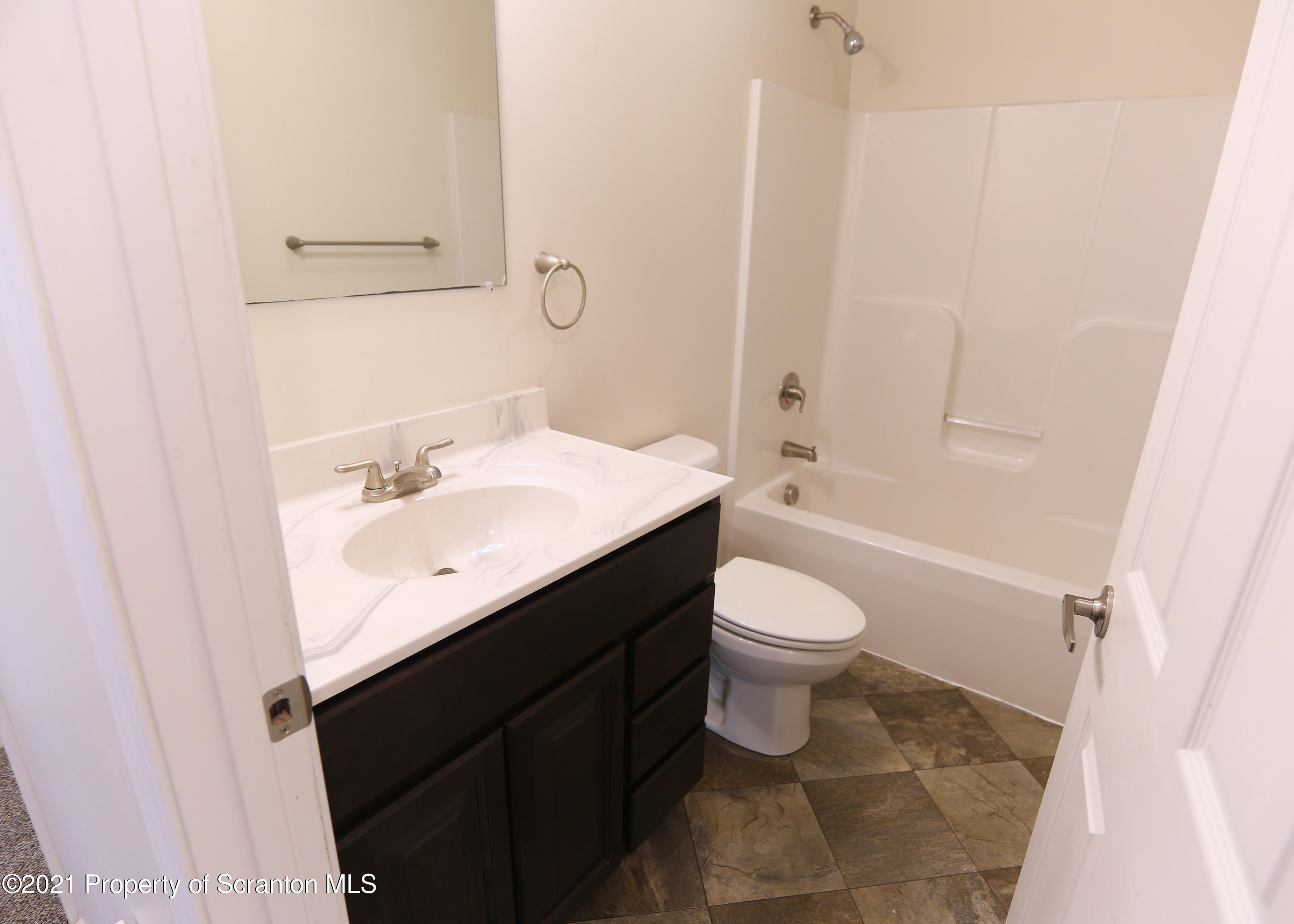 2526 Mack Road Hop Bottom, PA 18824 - Photo 19 of 40 a bathroom with a sink a toilet and shower