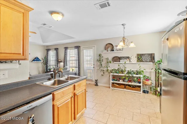 a open kitchen with stainless steel appliances granite countertop a sink and cabinets
