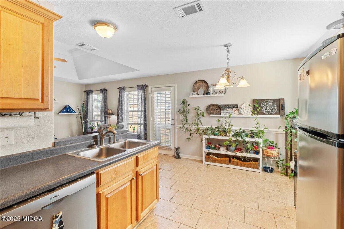125 Amber Drive Byron, GA 31008 - Photo 13 of 27 a open kitchen with stainless steel appliances granite countertop a sink and cabinets