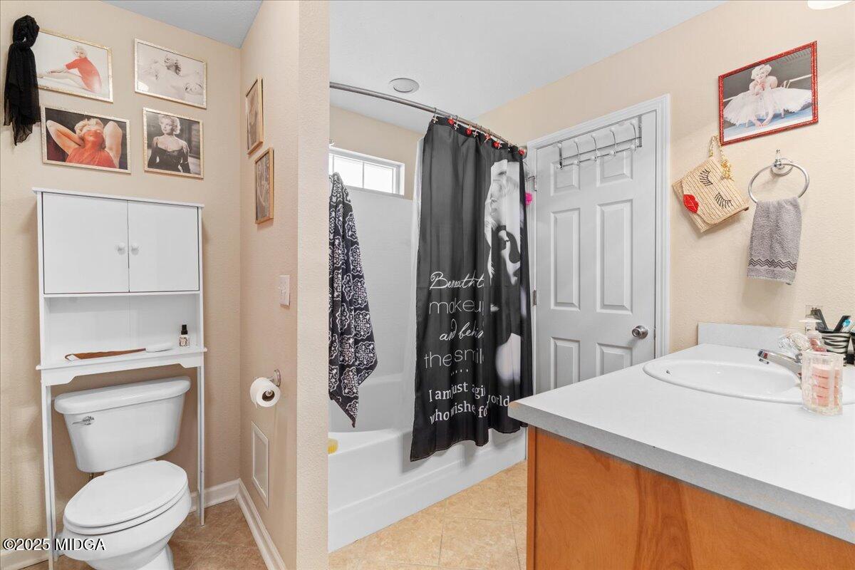 125 Amber Drive Byron, GA 31008 - Photo 19 of 27 a bathroom with a sink a toilet and shower