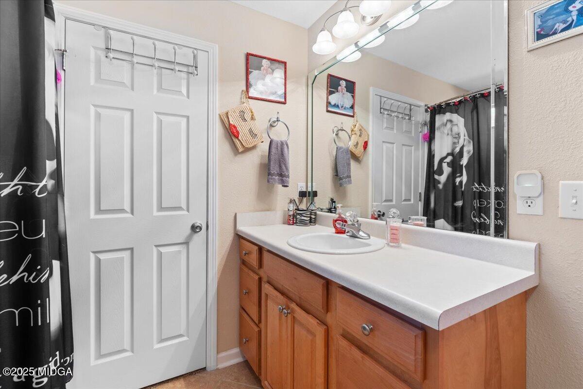 125 Amber Drive Byron, GA 31008 - Photo 20 of 27 a bathroom with a sink vanity and a mirror