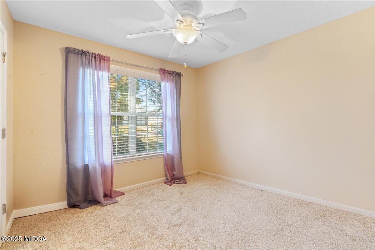 125 Amber Drive Byron, GA 31008 - Photo 22 of 27 an empty room with windows and fan