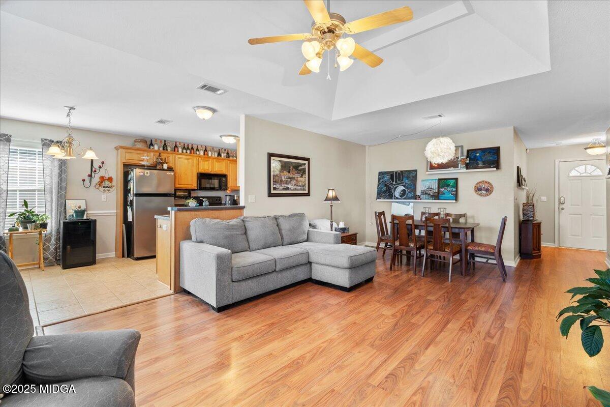125 Amber Drive Byron, GA 31008 - Photo 6 of 27 a living room with furniture kitchen view and a wooden floor