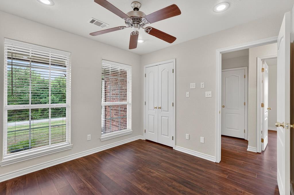 2828 Bennett Road Howe, TX 75459 - Photo 28 of 39 a view of an empty room with wooden floor and a window