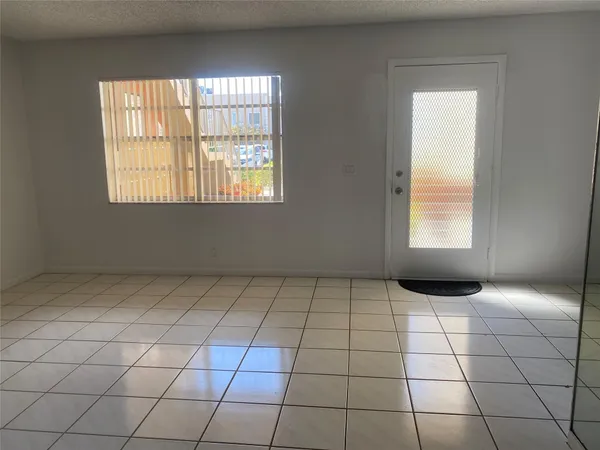a view of an empty room and window