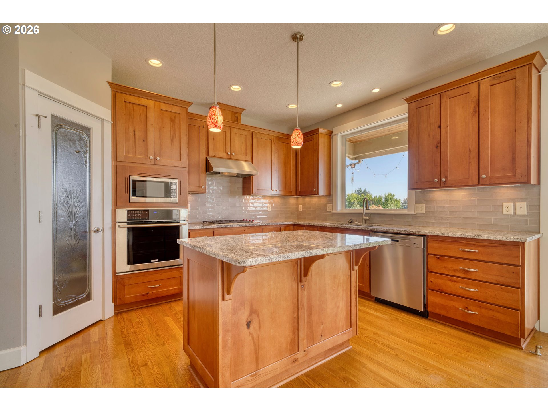33058 Church Road Warren, OR 97053 - Photo 15 of 45 a kitchen with stainless steel appliances granite countertop a sink a stove and a refrigerator