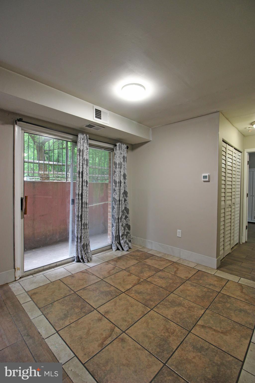 17 Water Street, Unit 30 Gaithersburg, MD 20877 - Photo 11 of 18 a view of an empty room with floor to ceiling window