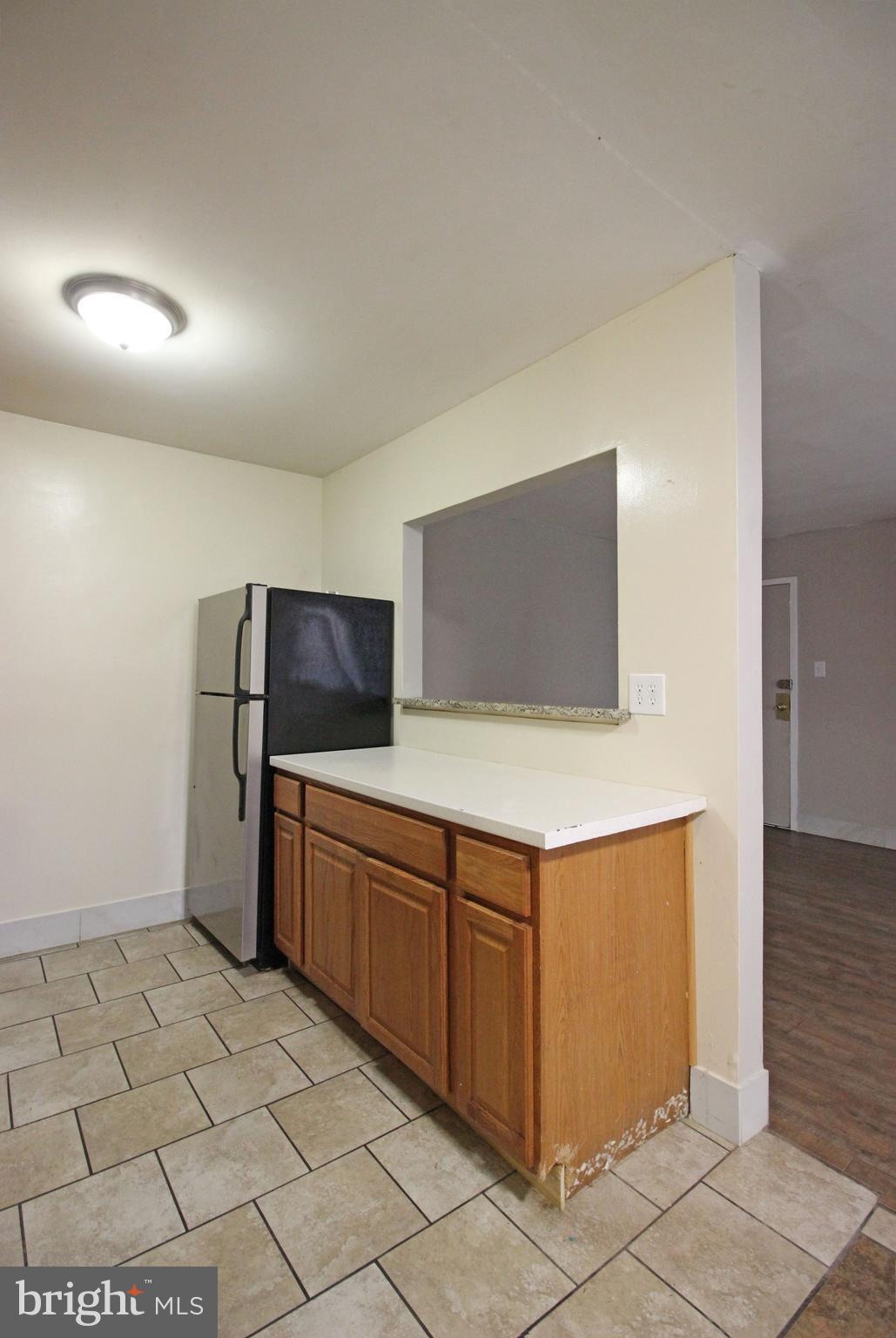 17 Water Street, Unit 30 Gaithersburg, MD 20877 - Photo 12 of 18 a kitchen with stainless steel appliances granite countertop a sink and cabinets
