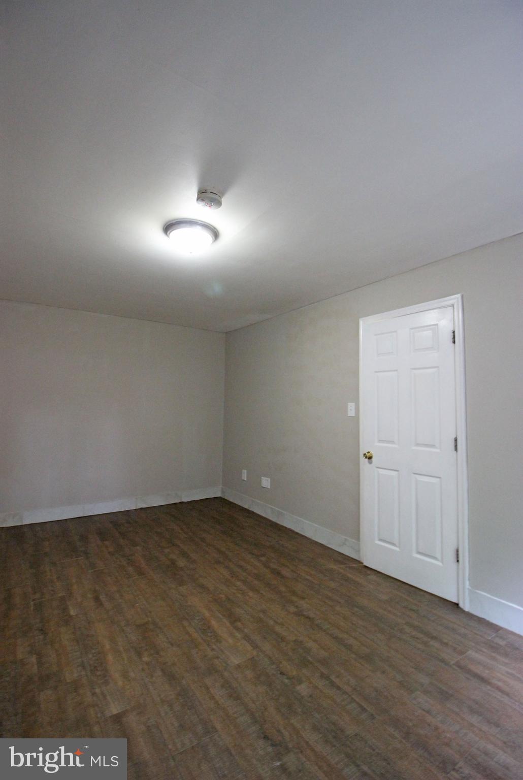 17 Water Street, Unit 30 Gaithersburg, MD 20877 - Photo 15 of 18 a view of an empty room and wooden floor