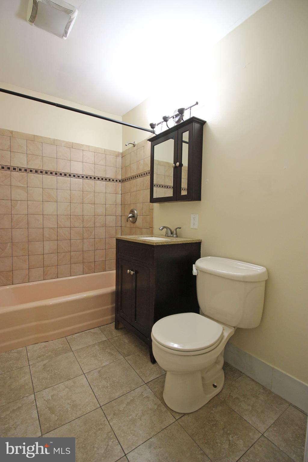 17 Water Street, Unit 30 Gaithersburg, MD 20877 - Photo 18 of 18 a bathroom with a toilet a sink and bathtub