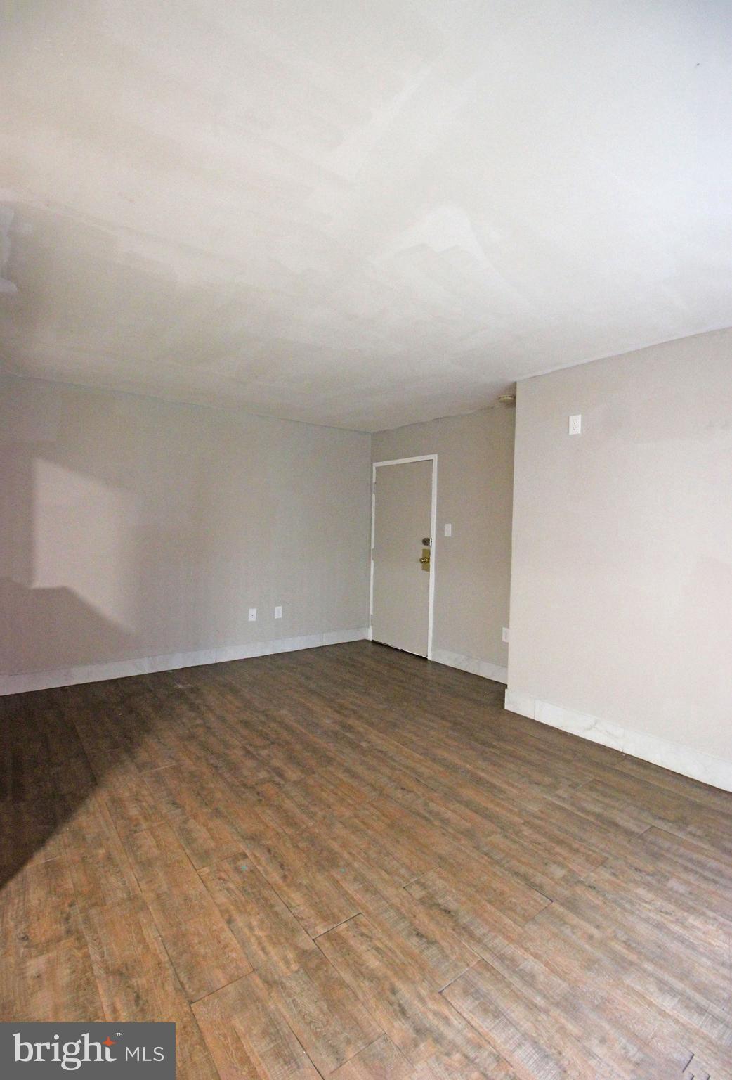 17 Water Street, Unit 30 Gaithersburg, MD 20877 - Photo 2 of 18 a view of an empty room and wooden floor