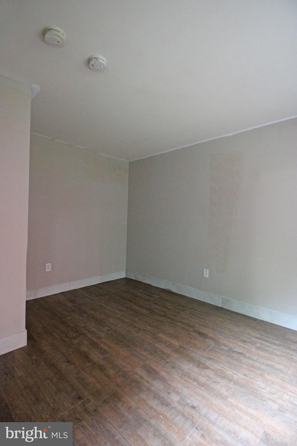 17 Water Street, Unit 30 Gaithersburg, MD 20877 - Photo 6 of 18 a view of an empty room and wooden floor