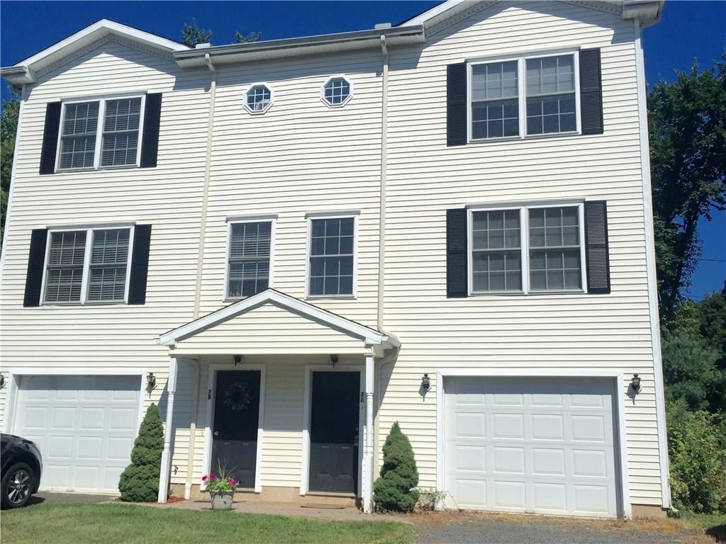 front of townhouse with one car garage