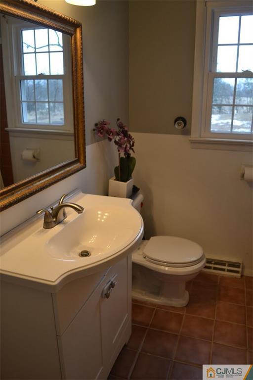 641 Scotch Road Pennington, NJ 08534 - Photo 22 of 24 a bathroom with a sink toilet and window