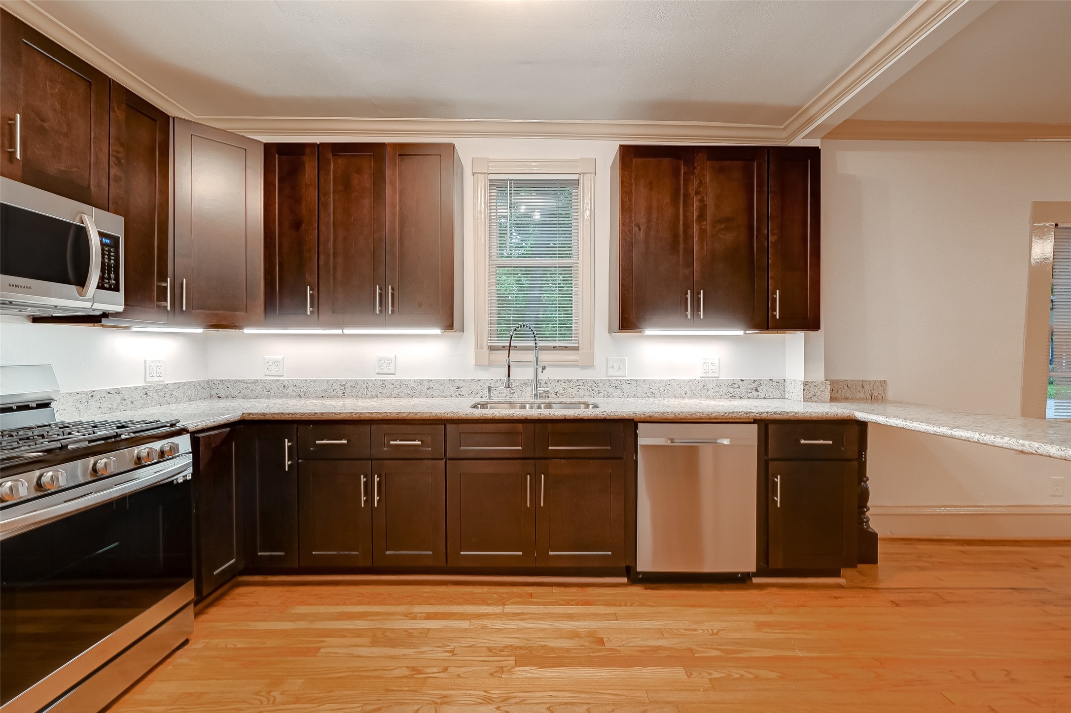 2009 State Street Houston, TX 77007 - Photo 20 of 42 The kitchen is one of the premier features of the restoration. Custom tall wood cabinets make way for plenty of storage.