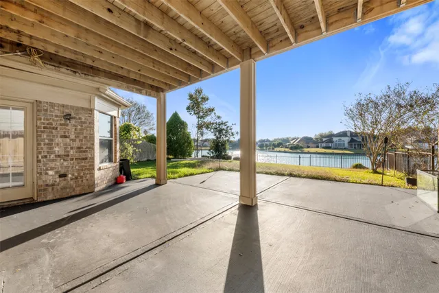 a view of a lake with houses in the background