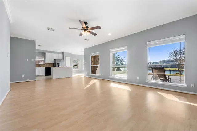 a view of a livingroom with kitchen and furniture