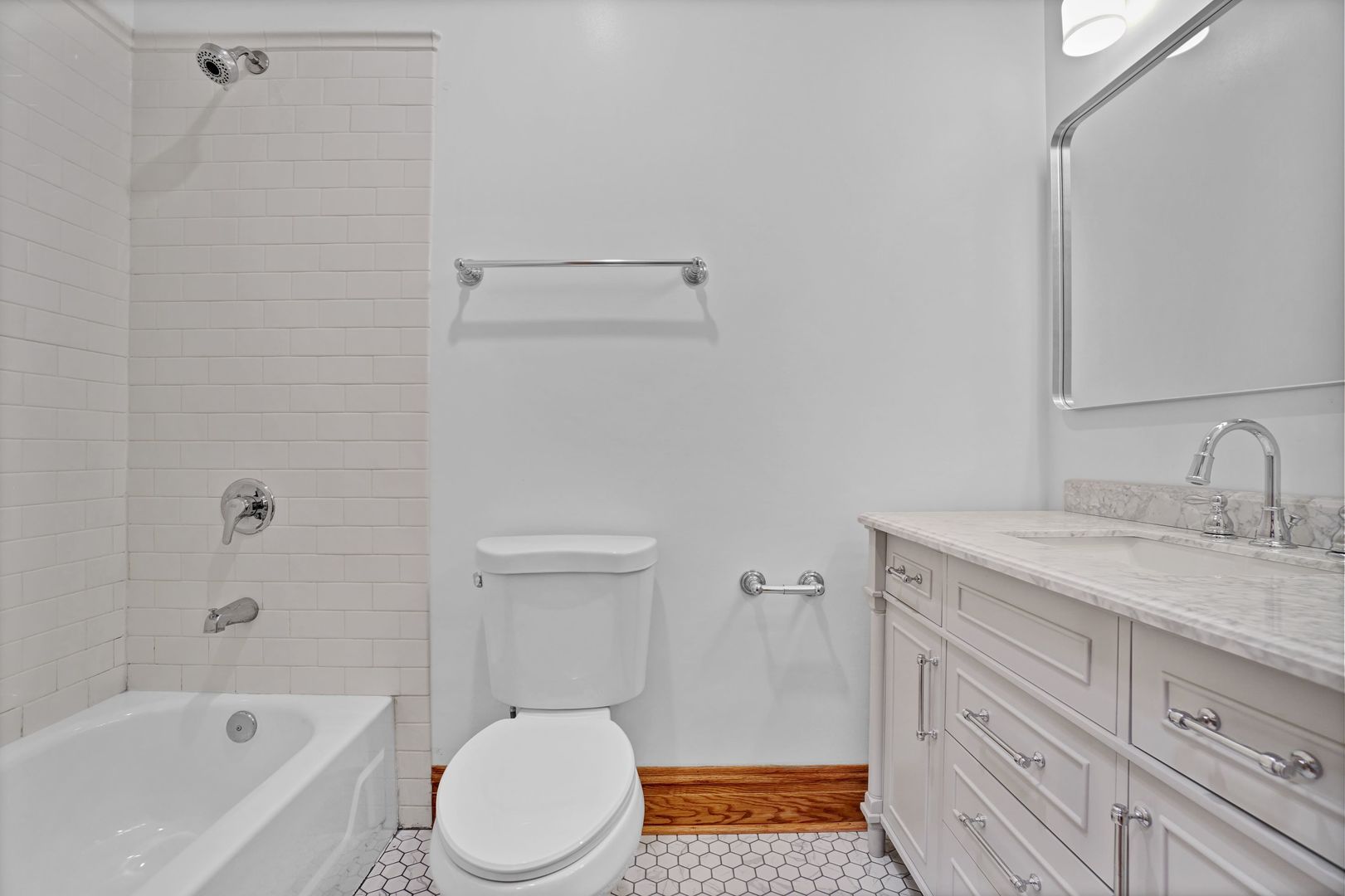 849 West Grace Street, Unit 2 Chicago, IL 60613 - Photo 15 of 19 a bathroom with a granite countertop sink toilet and shower