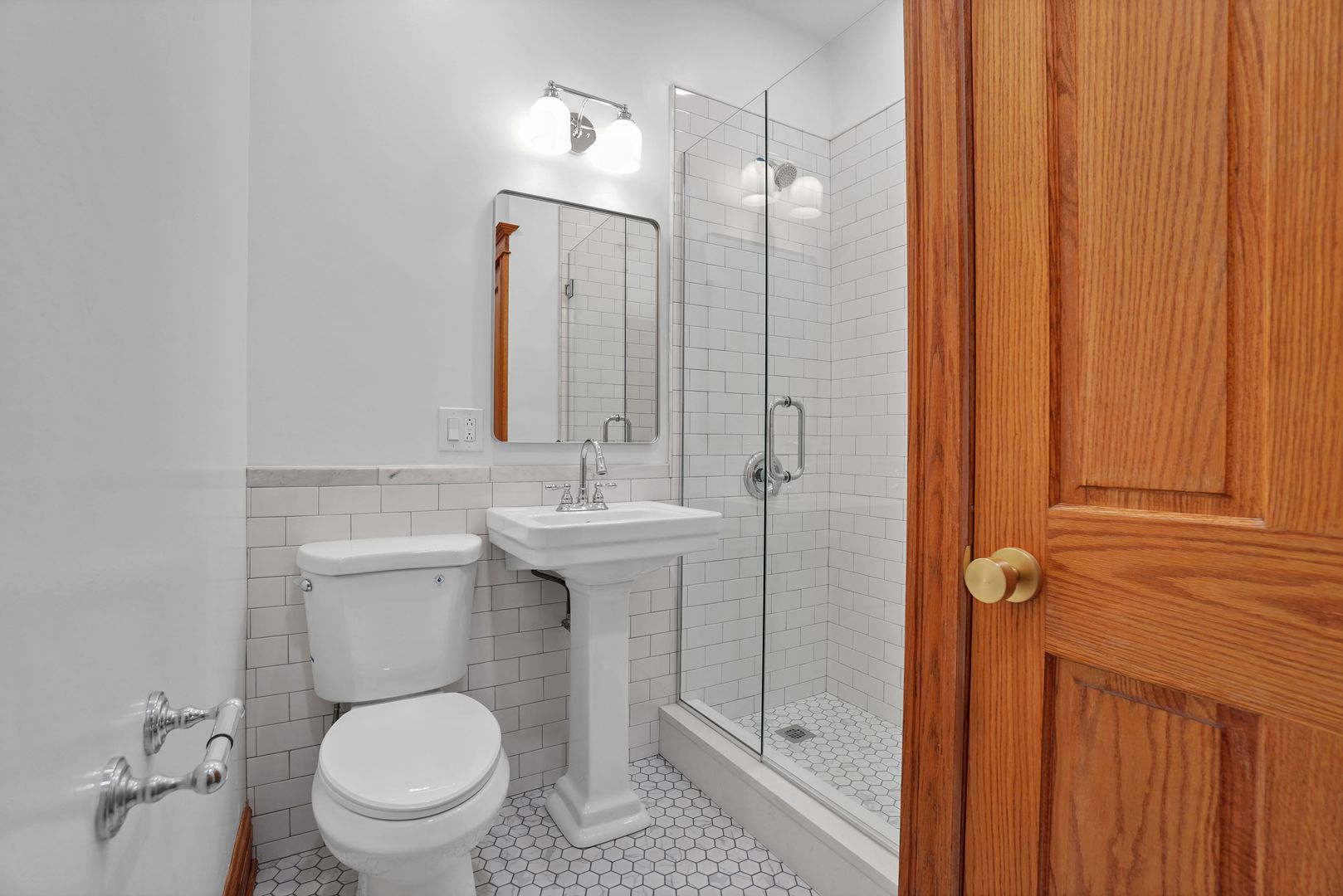 849 West Grace Street, Unit 2 Chicago, IL 60613 - Photo 18 of 19 a bathroom with a toilet a sink and shower