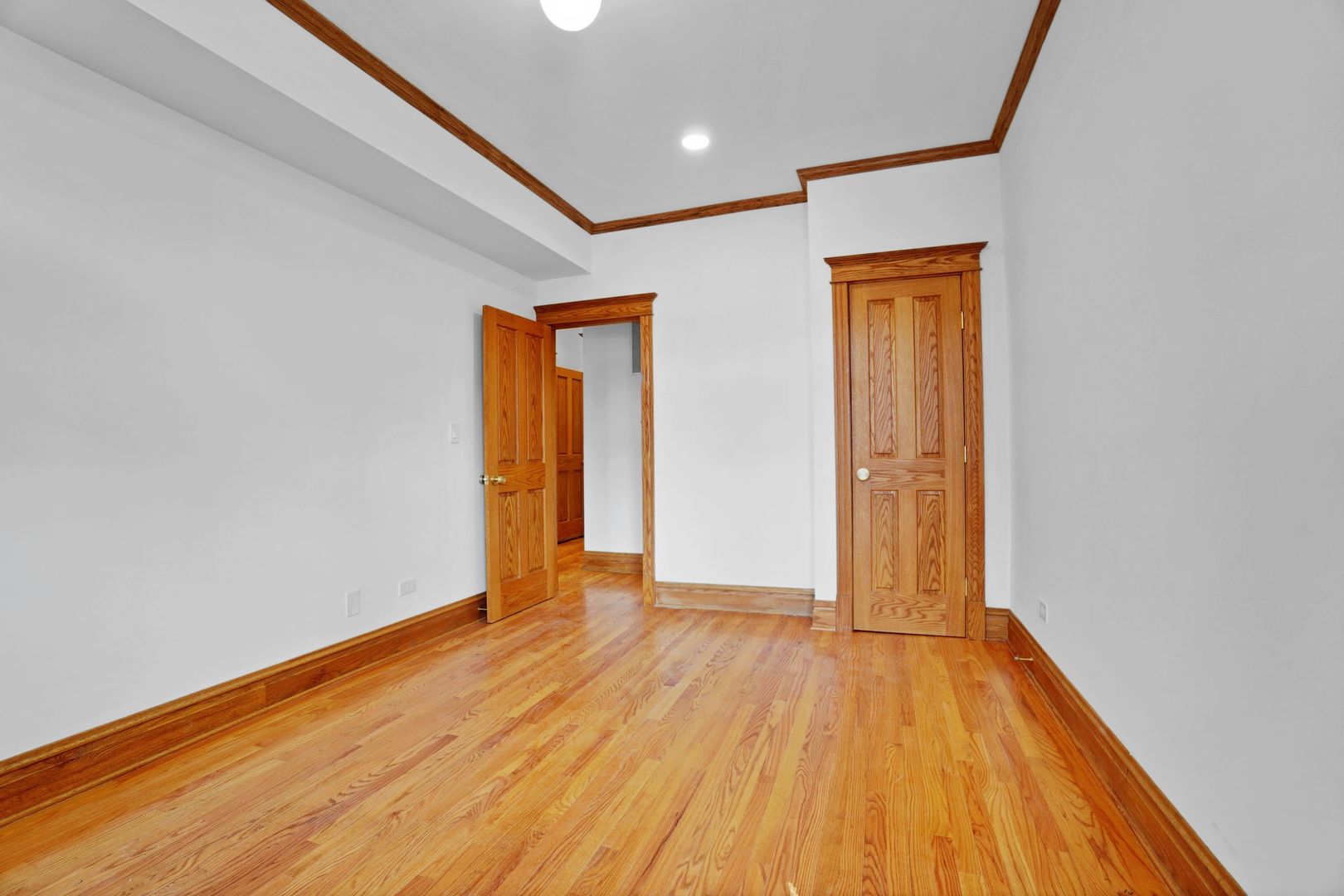 849 West Grace Street, Unit 2 Chicago, IL 60613 - Photo 6 of 19 a view of an empty room with wooden floor