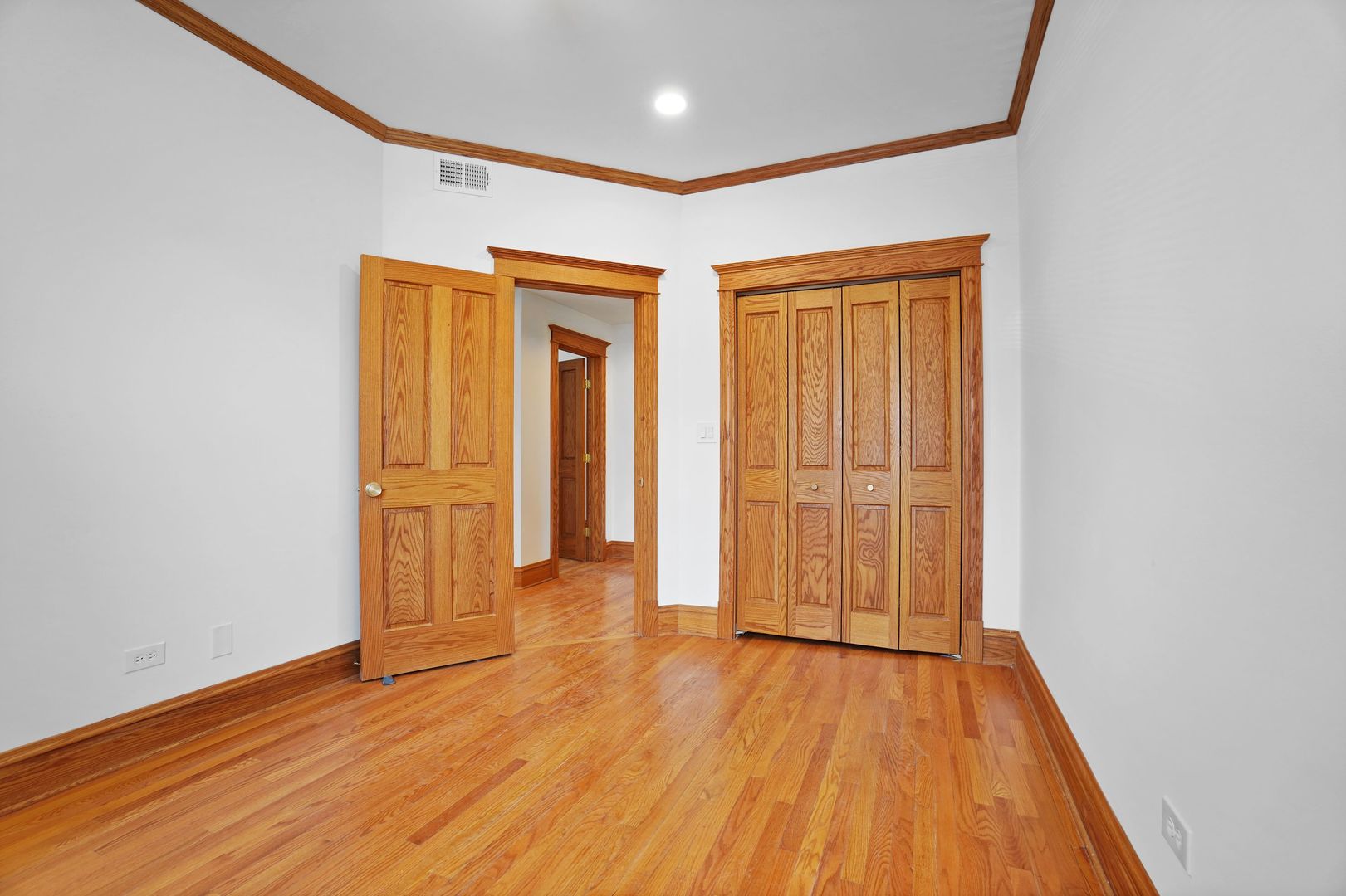 849 West Grace Street, Unit 2 Chicago, IL 60613 - Photo 10 of 19 a view of wooden floor in an empty room