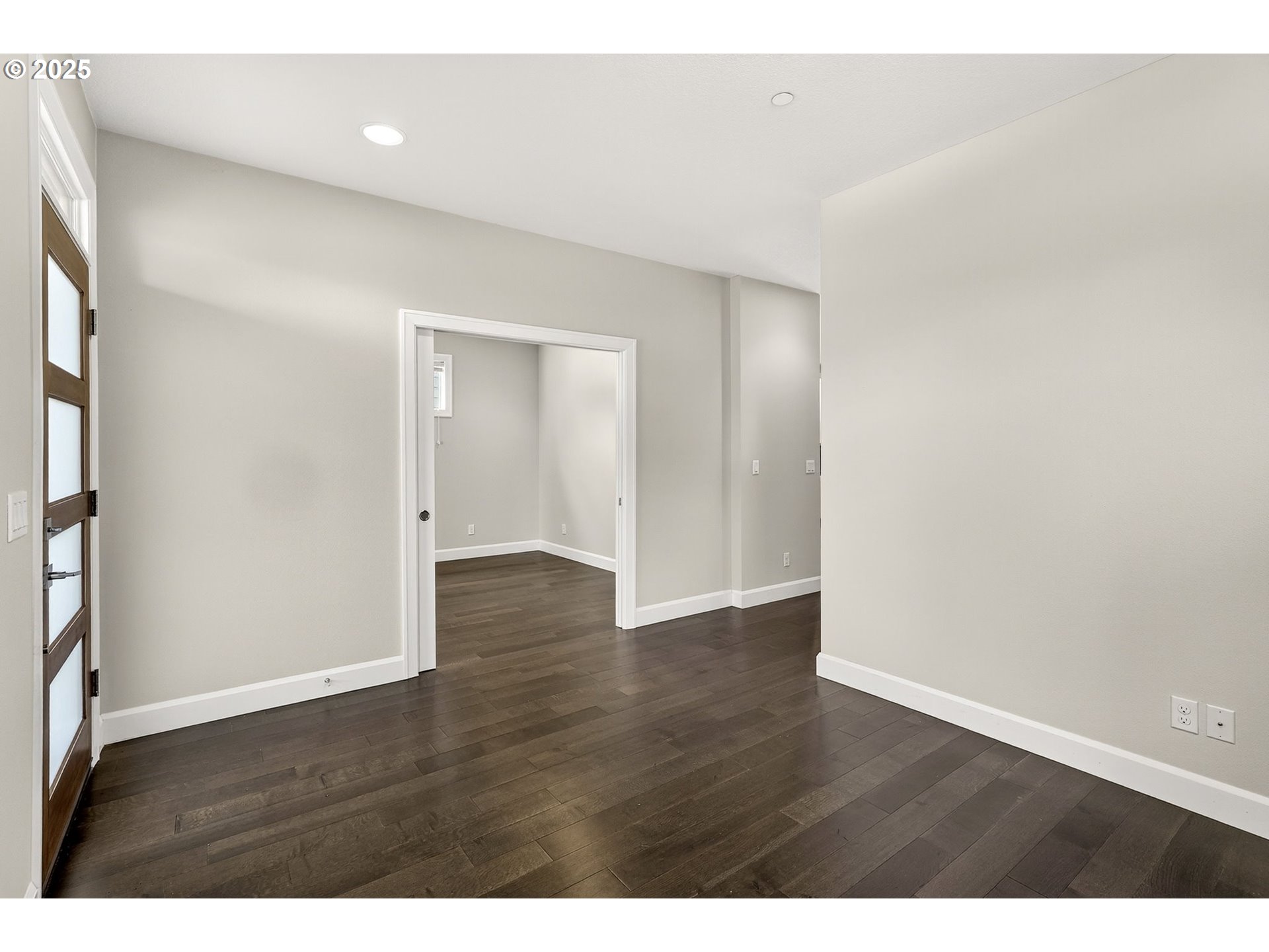 7830 Southeast Boise Court Portland, OR 97206 - Photo 12 of 48 a view of an empty room with wooden floor and closet