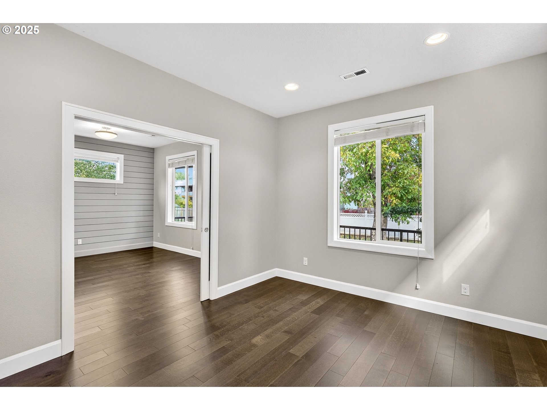 7830 Southeast Boise Court Portland, OR 97206 - Photo 15 of 48 an empty room with wooden floor and windows