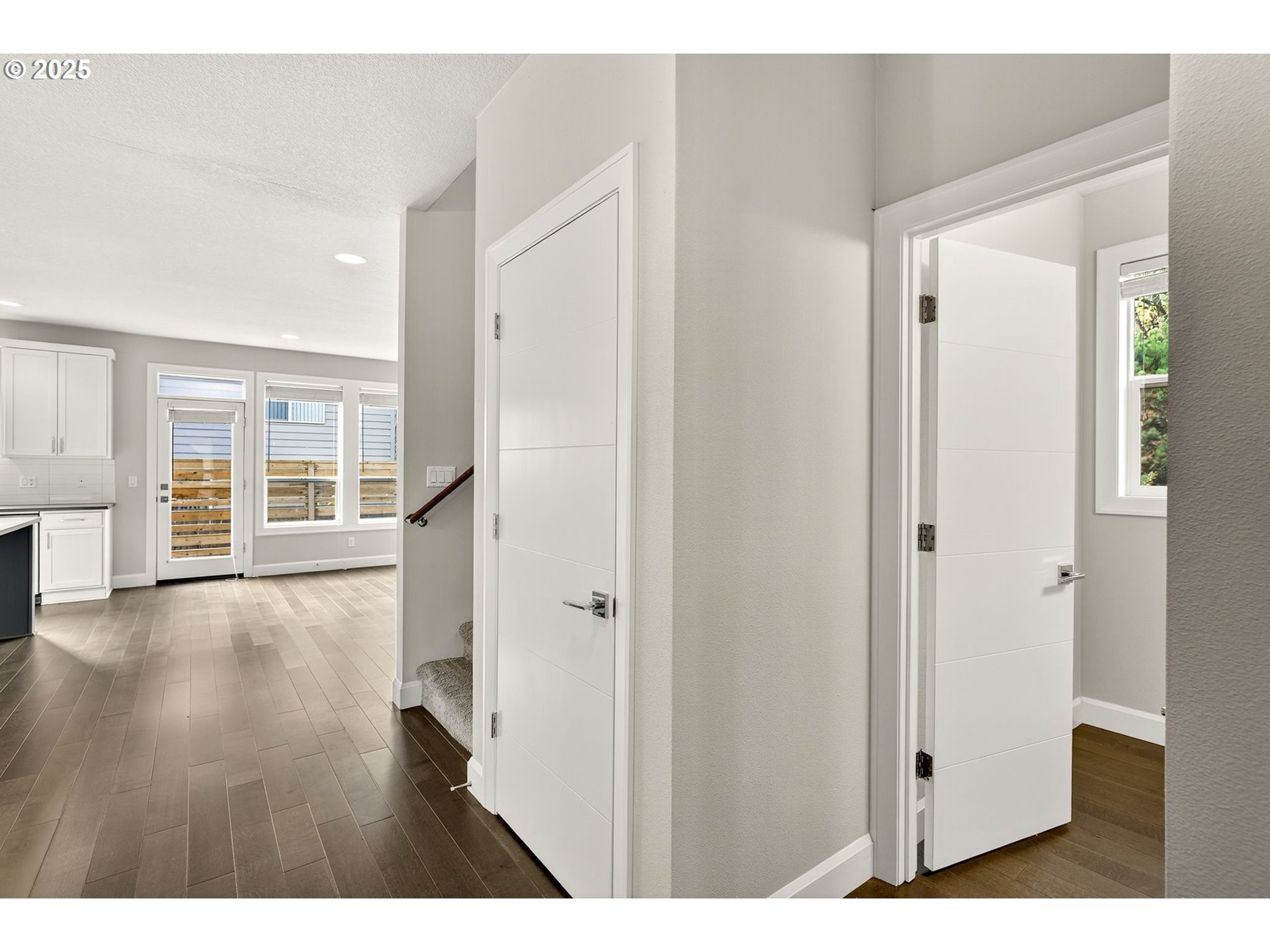 7830 Southeast Boise Court Portland, OR 97206 - Photo 17 of 48 a view of empty room with wooden floor and windows