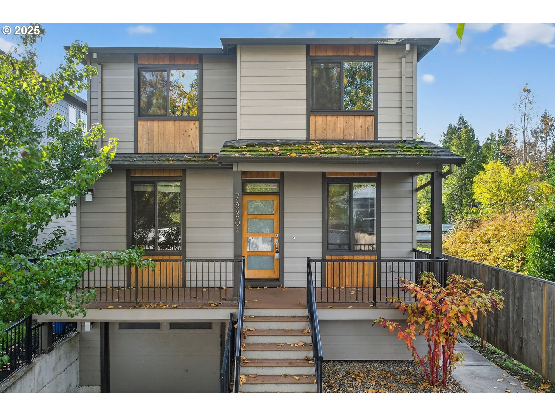 7830 Southeast Boise Court Portland, OR 97206 - Photo 2 of 48 a view of a house with large windows and plants