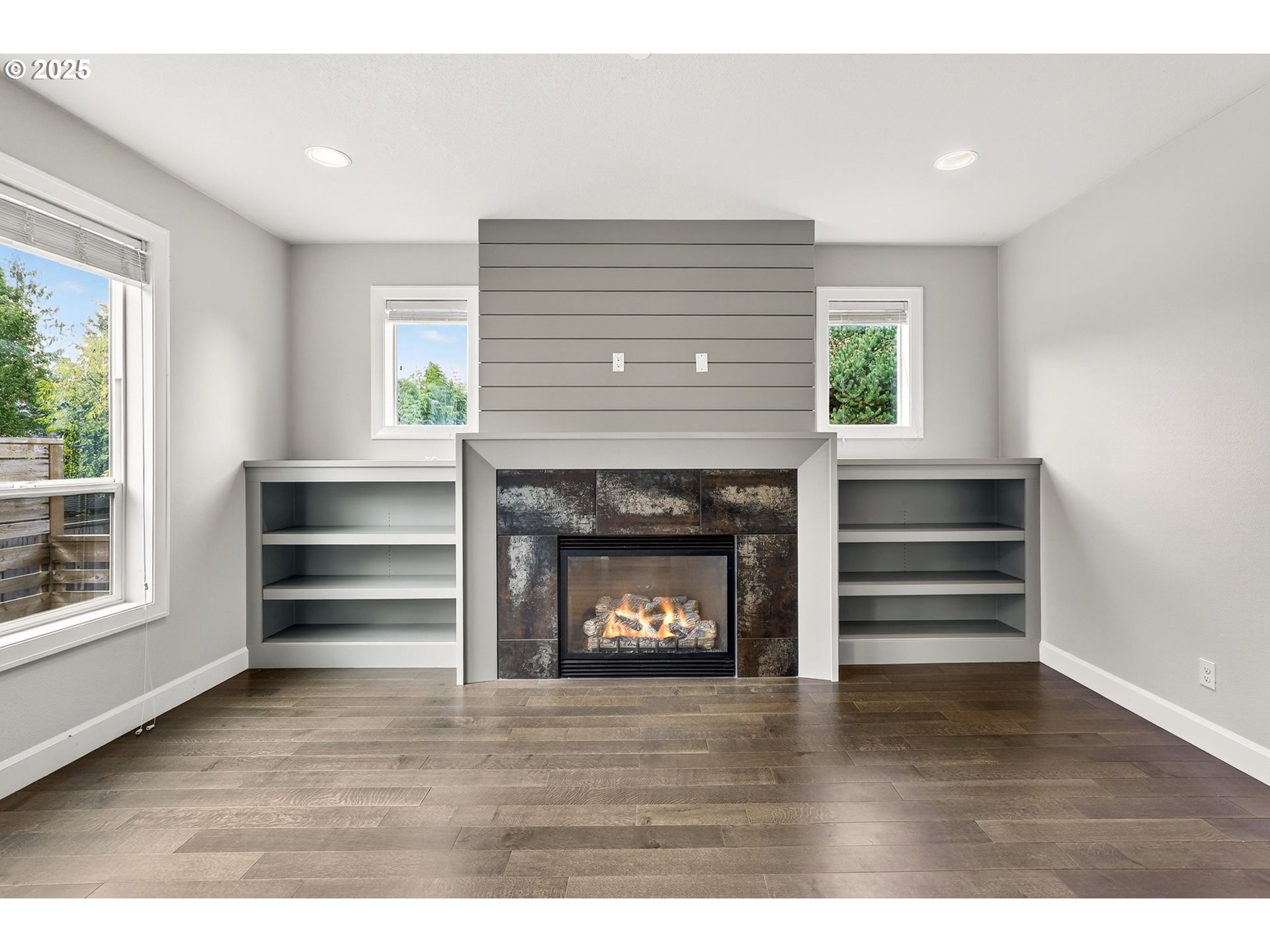 7830 Southeast Boise Court Portland, OR 97206 - Photo 23 of 48 a view of an empty room with a fireplace and a window