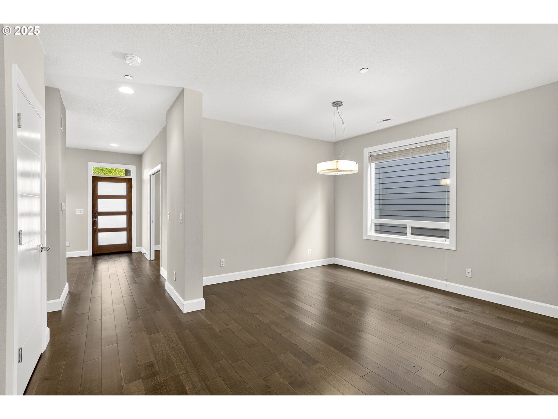 7830 Southeast Boise Court Portland, OR 97206 - Photo 27 of 48 a view of an empty room with wooden floor and a window