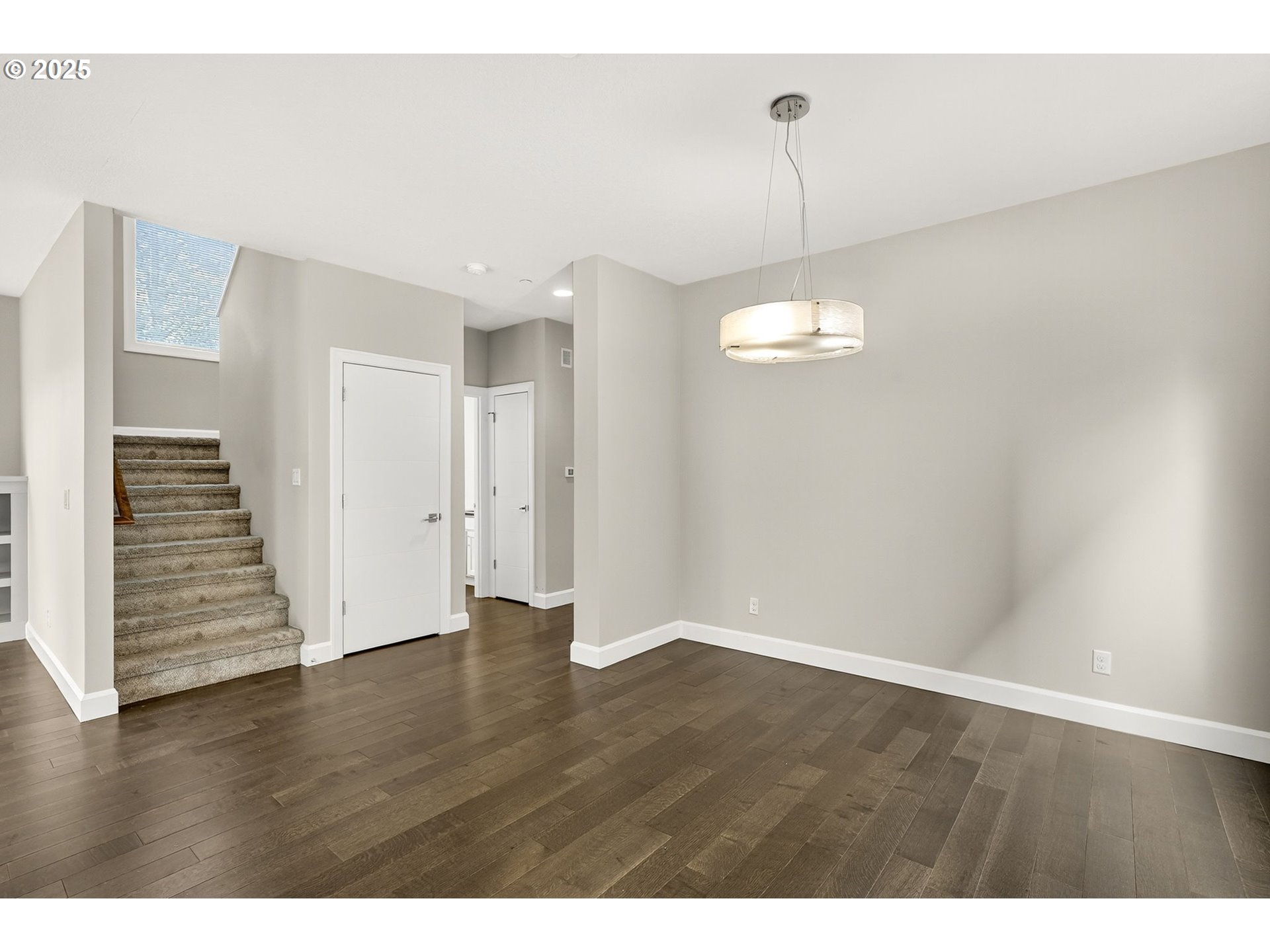 7830 Southeast Boise Court Portland, OR 97206 - Photo 30 of 48 a view of empty room with wooden floor and fan